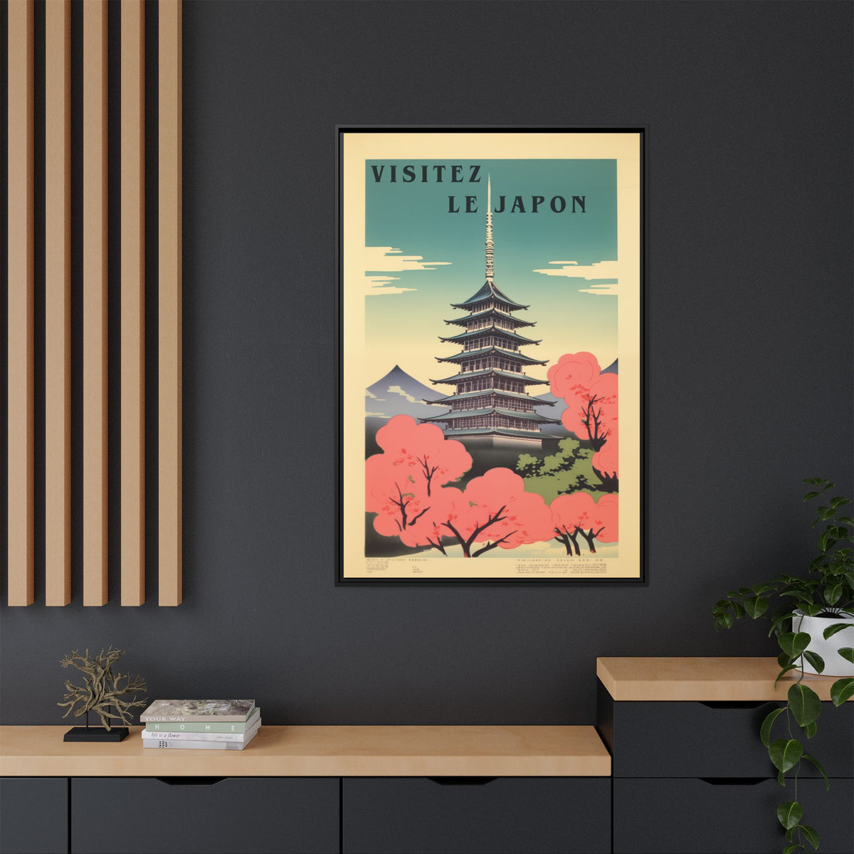 Visitez Le Japon vintage pagoda travel artwork, 32 × 48, black framed canvas, displayed on a dark charcoal slatted wall above a light wood sideboard