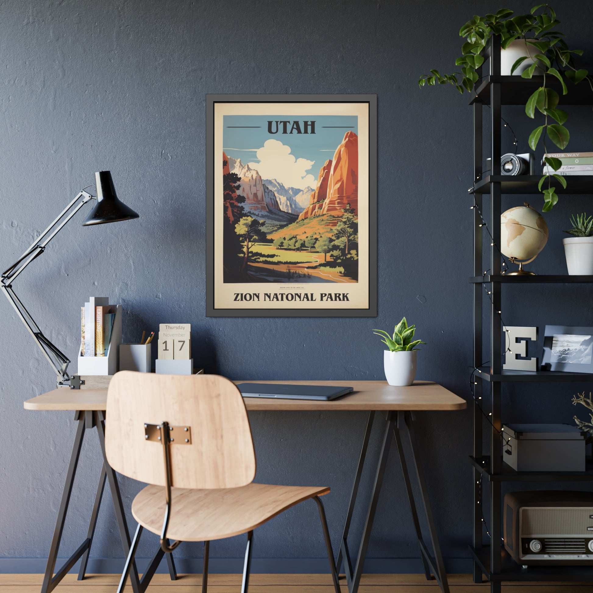 Framed vintage Utah Zion National Park travel art print on a home office desk with a lamp