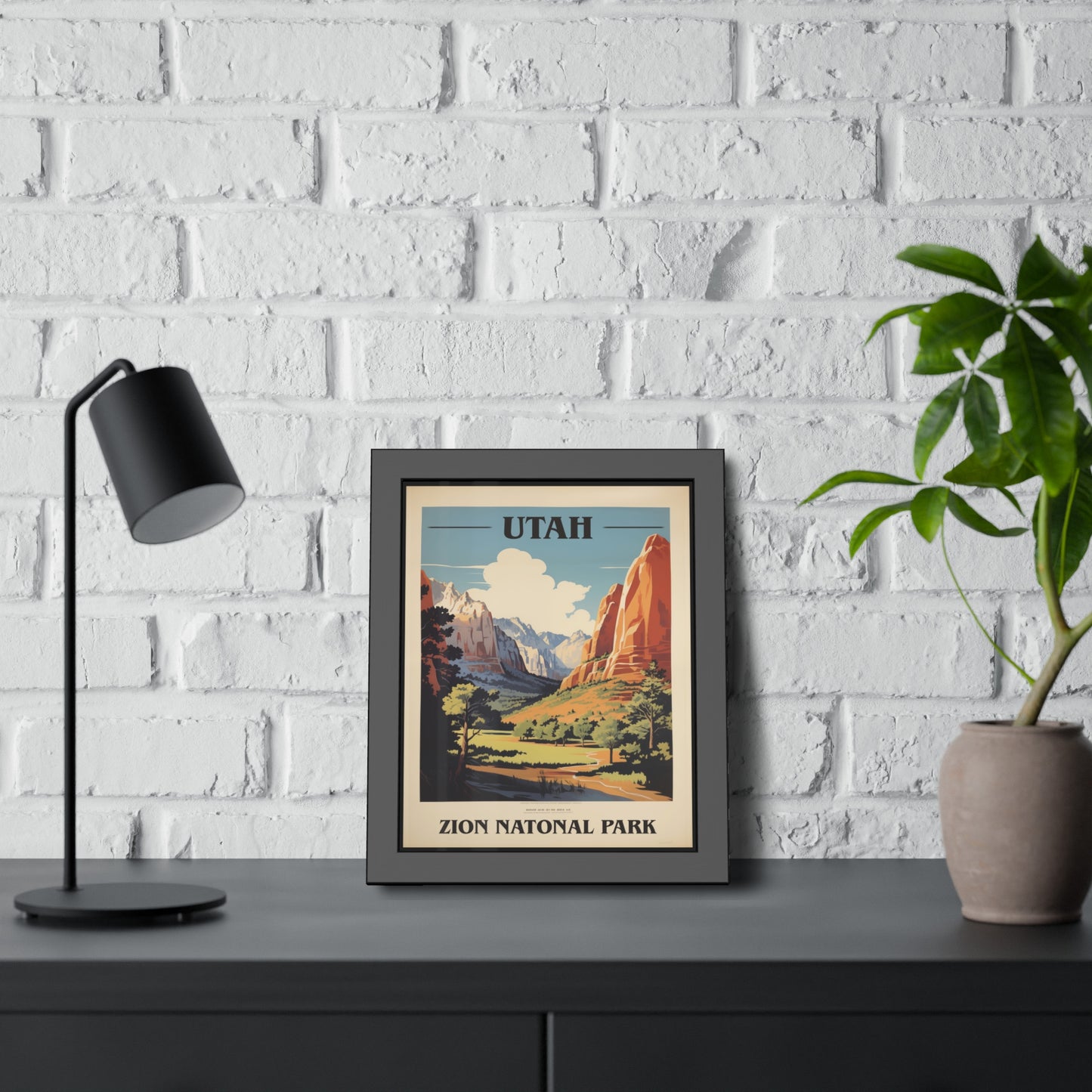 Framed vintage Utah Zion National Park travel art print on a dark shelf, alternate view