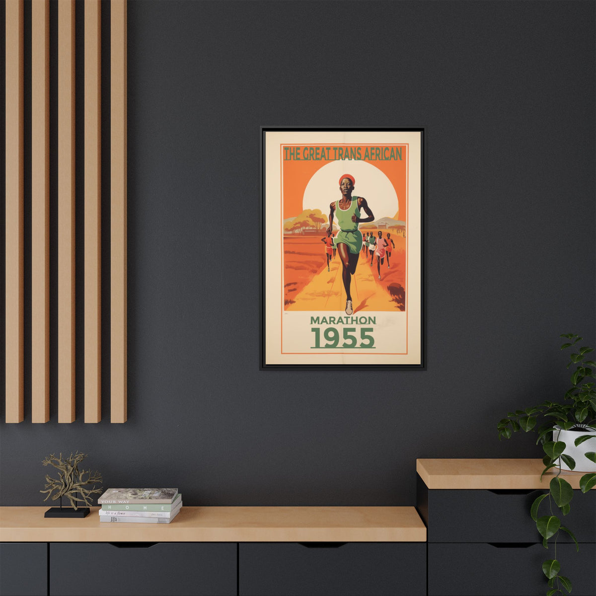 Vintage 1955 Great Trans African Marathon artwork, 24 × 36, black framed canvas, displayed on a dark charcoal wall above a light wood bench