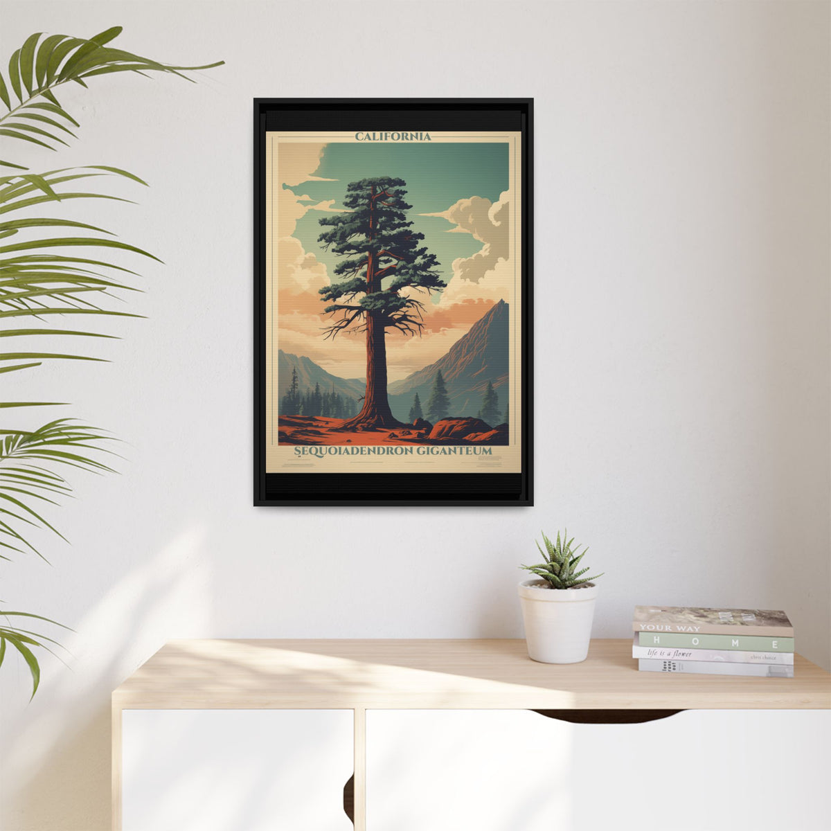 California Sequoiadendron Giganteum vintage nature artwork, 20 × 30, black framed canvas, displayed on a white wall above a low cabinet, beside a potted plant in daylight